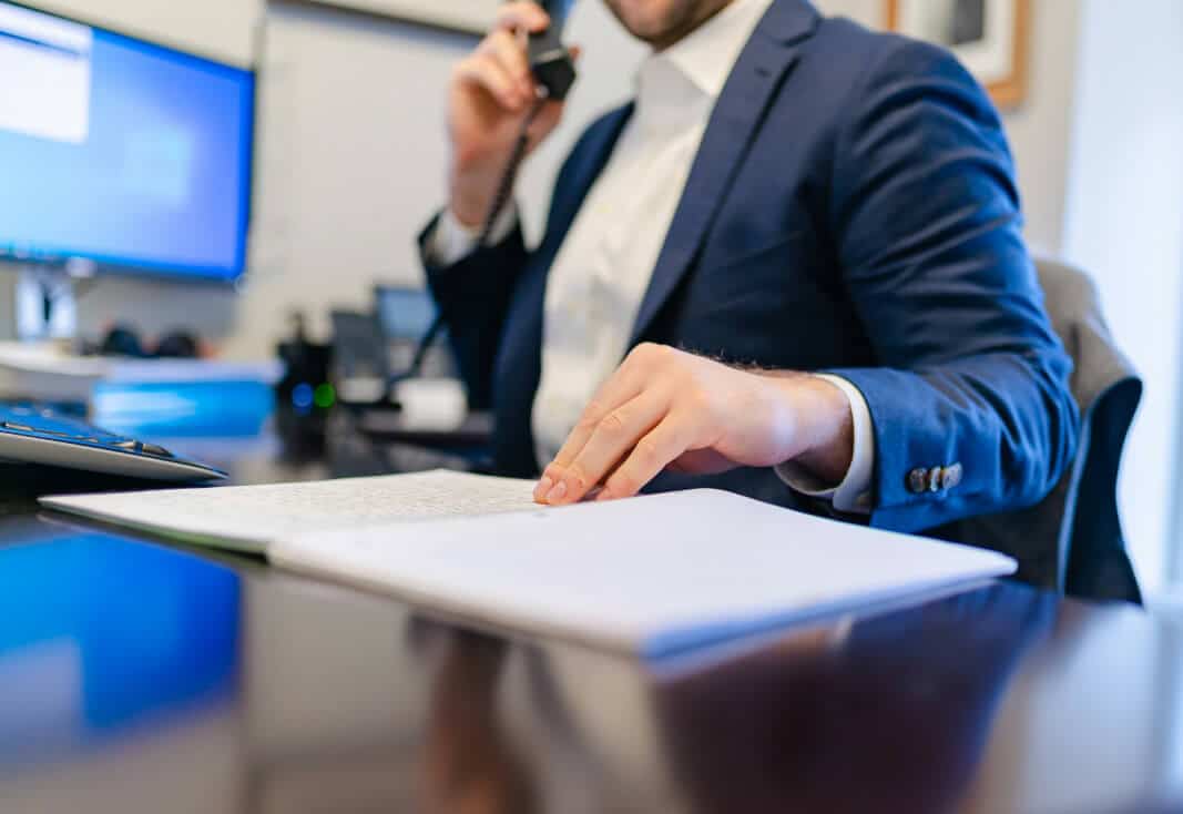 A Mortgage Advisor In Essex Working At His Desk